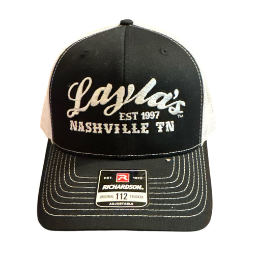 Black and white cap with 'Layla's' branding on a white background