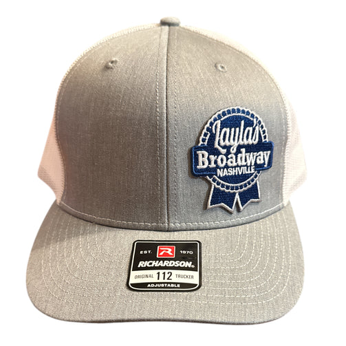 Gray and beige trucker hat with Layla's Broadway Nashville logo on a white background
