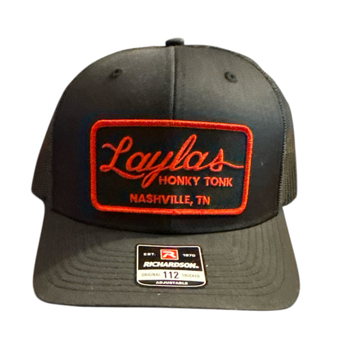 Black cap with red and white text on a white background